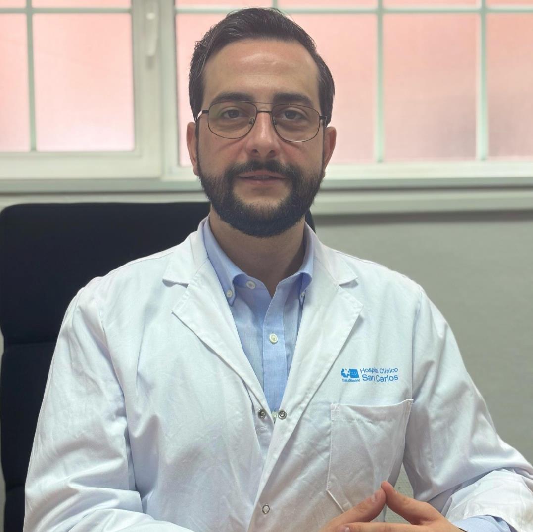 man in white dress shirt wearing black framed eyeglasses